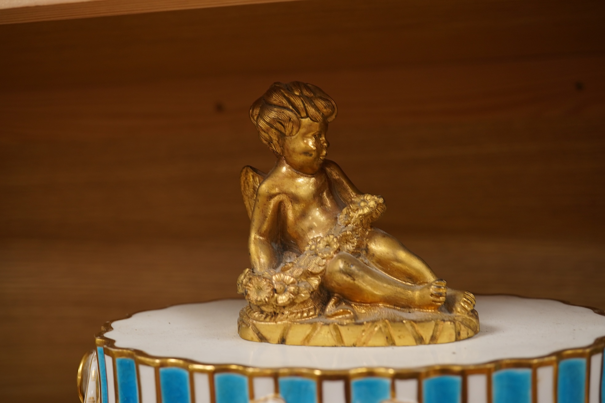 A 19th-century Sevres style porcelain mantel clock, 29cm tall